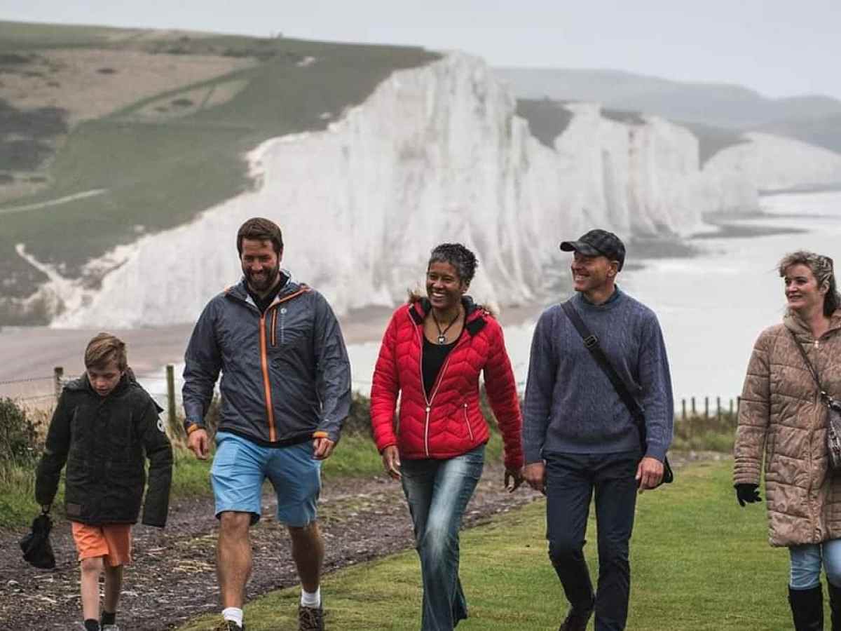 a group of people standing in a field